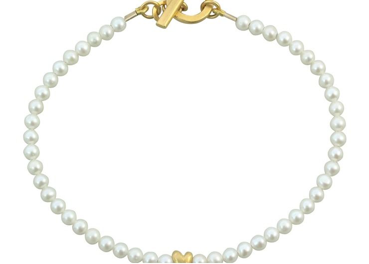 Pearl and tiny gold plated heart bracelet