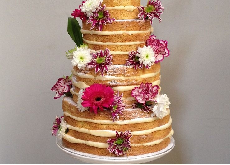 Naked wedding cake with fresh flowers